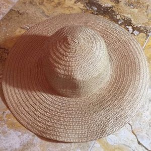 Straw Sun hat, a bit floppy and great in heat/sun. Travels well